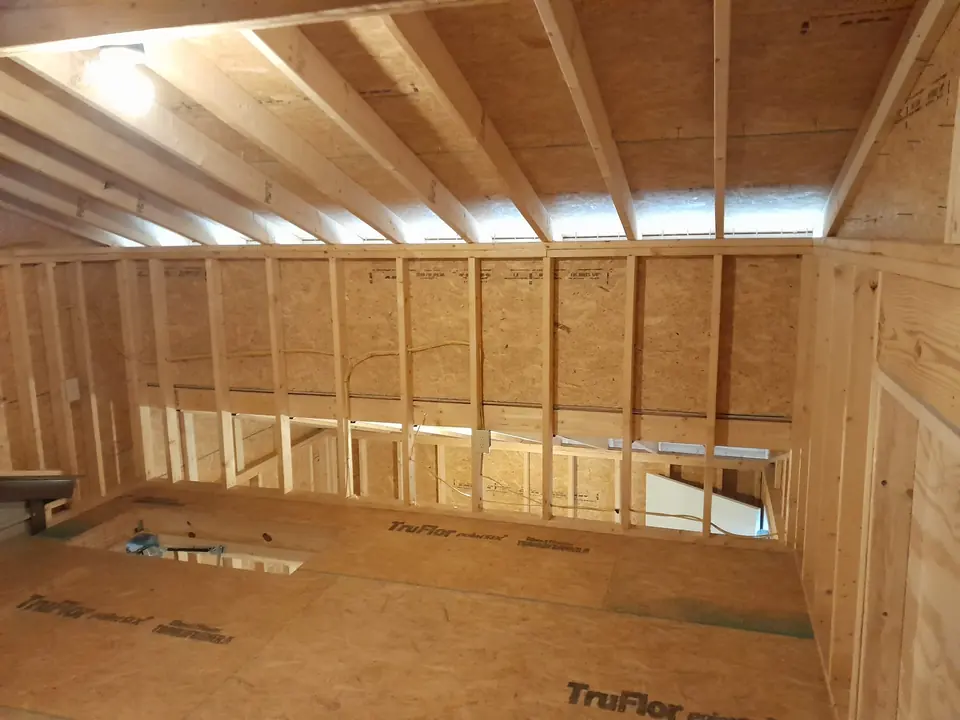 Interior wood framing inside an outbuilding