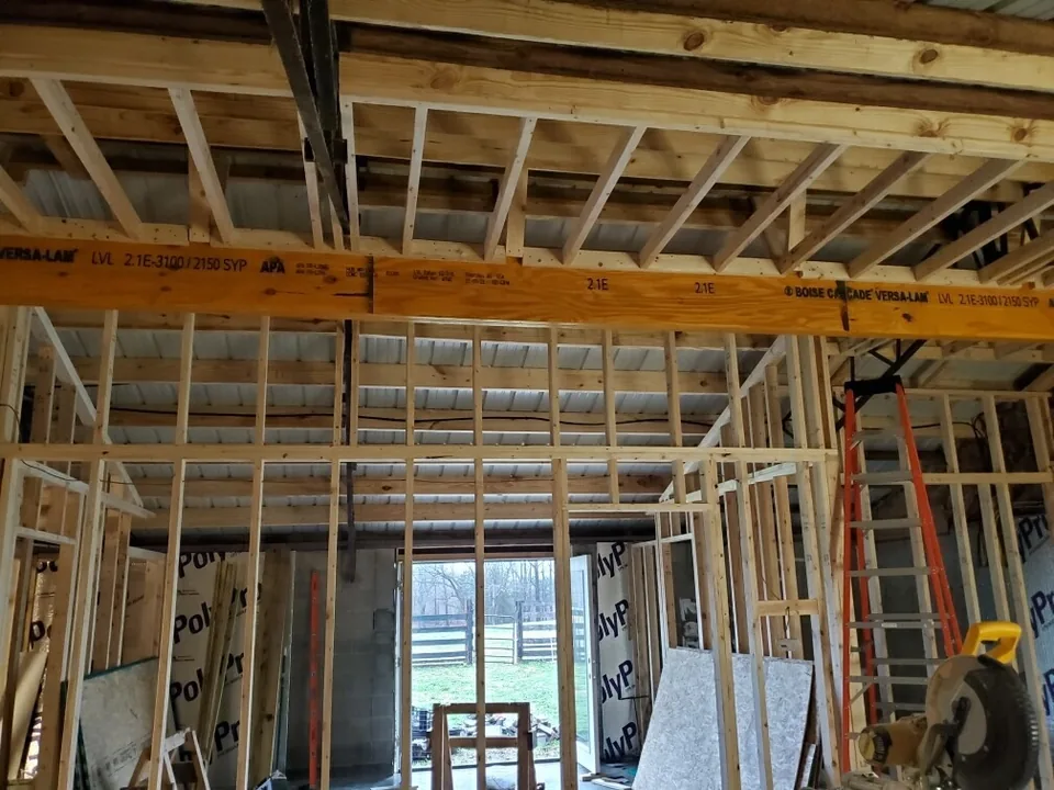 Interior room framing with exposed studs and ceiling joists
